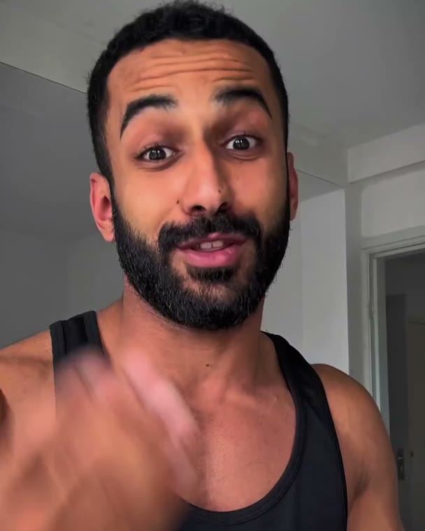 Moo in a black gym tank top, close-up
