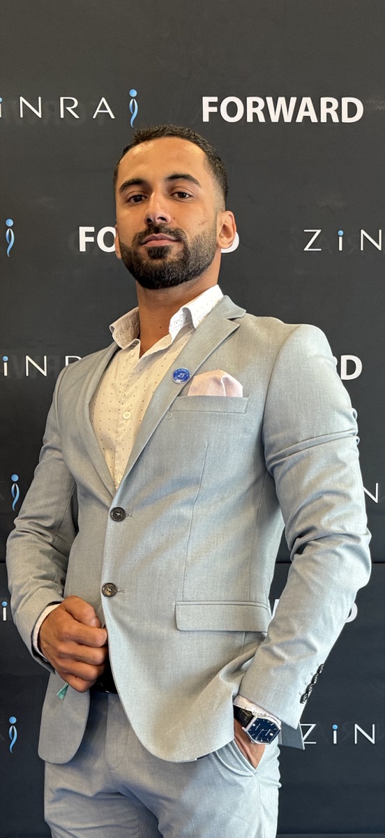 Moo in a light grey suit at an event
