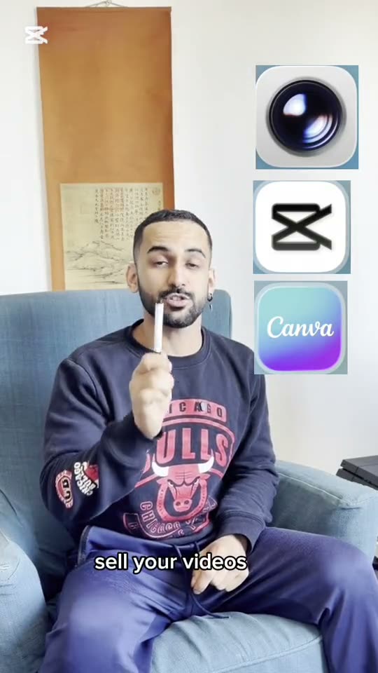 Moo seated in a Bulls sweatshirt explaining with app icons on screen